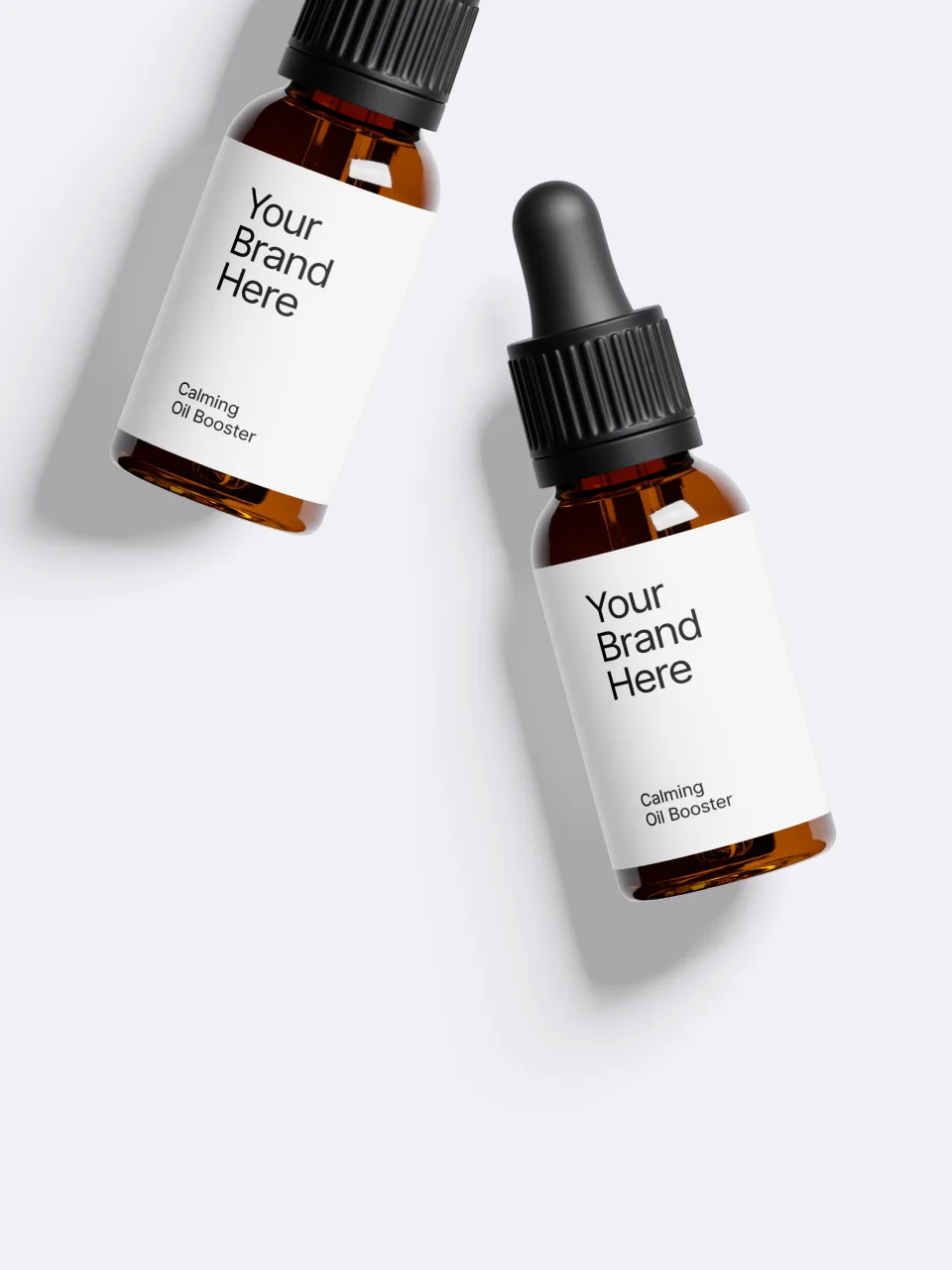 Two amber dropper bottles mocked up with a 'Your Brand Here' placeholder label