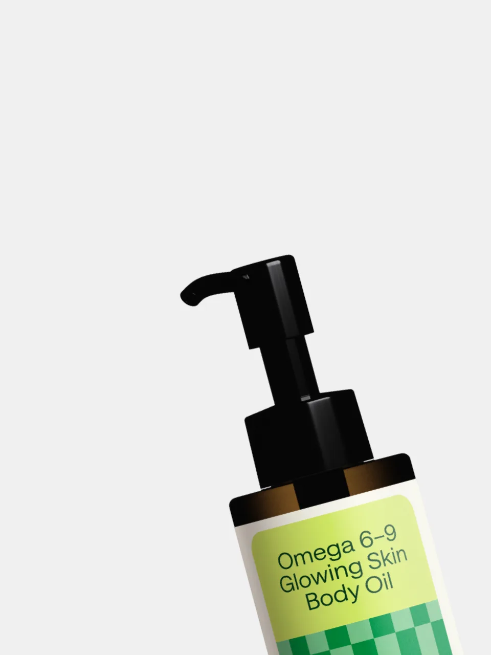 Green-labeled "Omega 6-9 Glowing Skin Body Oil" pump bottle against a light grey background (