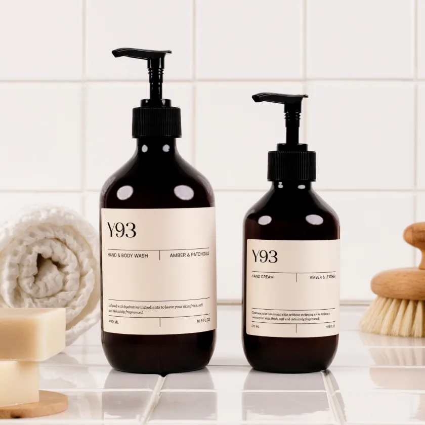 Two amber pump bottles on a bathroom shelf, illustrating the private label skincare guide